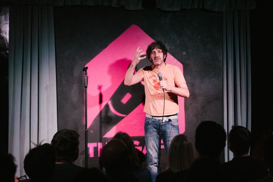 man on stage with mic